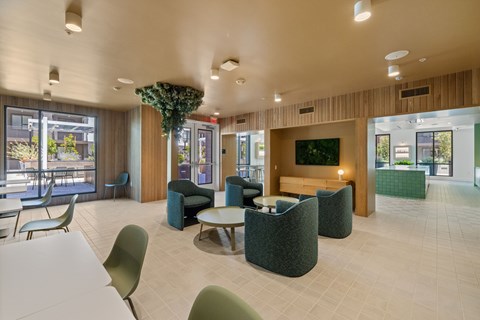 A large room with a long table and chairs.
