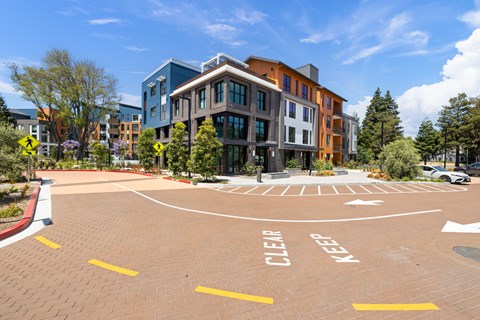 A parking lot with the words "CLEAR" and "KEEP" painted on the ground.