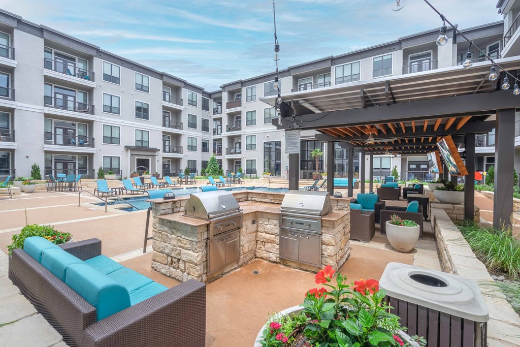 our apartments showcase a naturally well lit living area with a fire pit