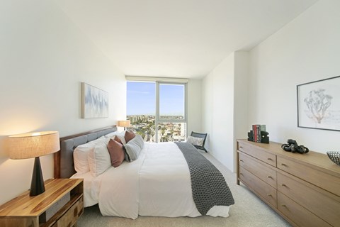 a bedroom with a bed and a dresser