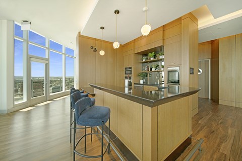 a kitchen with an island and stools