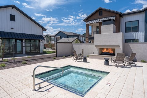 A modern house with a pool and a fireplace.