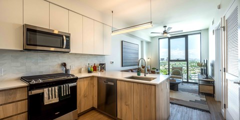 a kitchen with a stove top oven next to a sink