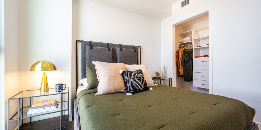 a bedroom with a bed and a closet