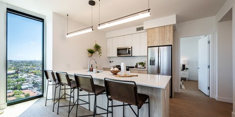 a kitchen with breakfast bar and stools