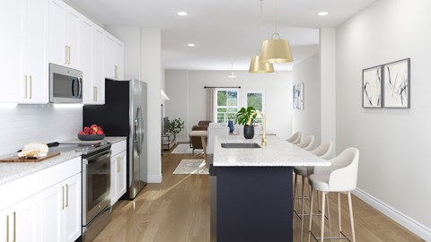 A modern kitchen with a dark blue island and white cabinets.