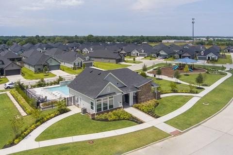 A residential area with houses and a swimming pool.