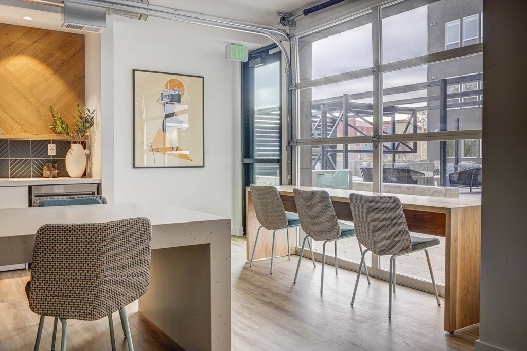 Clubroom with seating area overlooking the outdoor courtyard