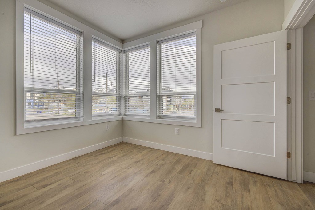 Empty bedroom space with windows