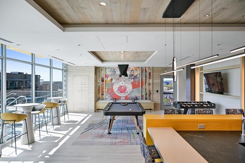 a games room with a ping pong table and a foosball table