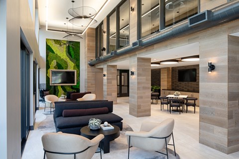 a living room with couches and chairs and a television