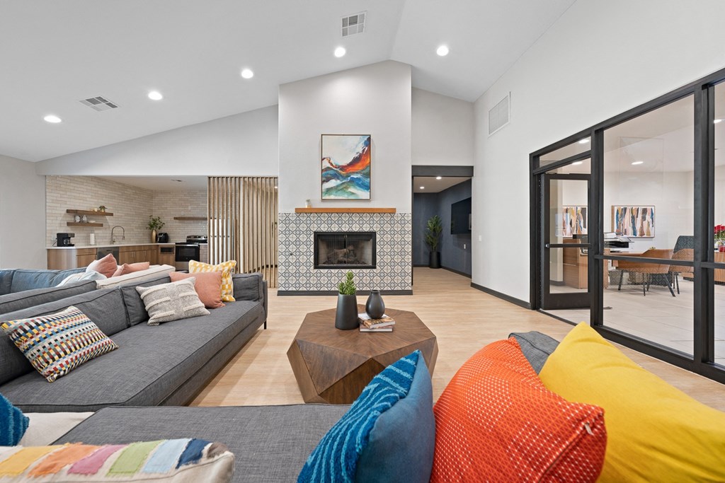 a living room with couches and a fireplace
