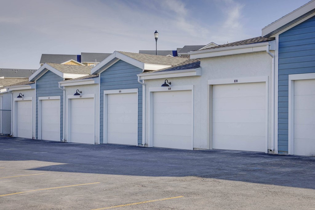 a row of blue and white garage doors