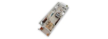 A top-down view of a living room with a couch, coffee table, and a staircase leading to another room.