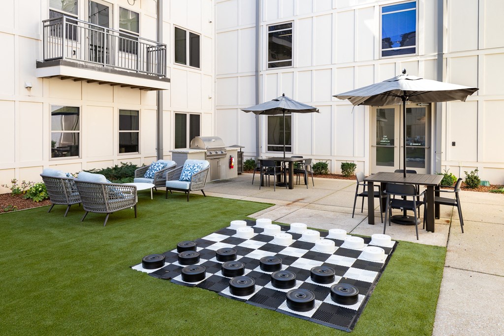 a chess board in the yard of an apartment building