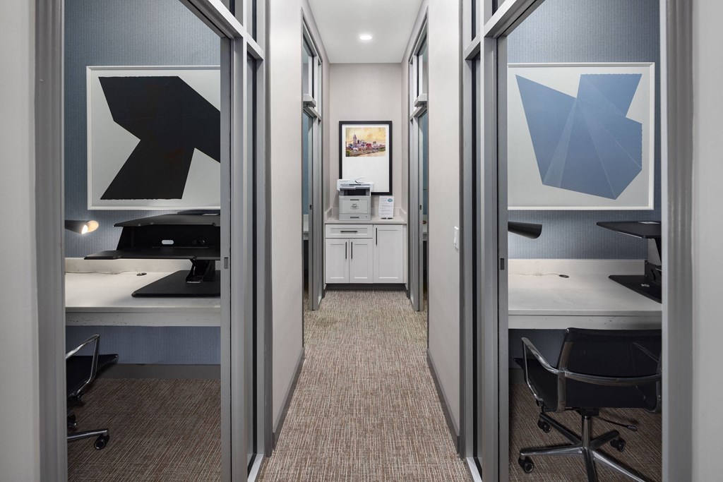 a conference room with a desk and a door