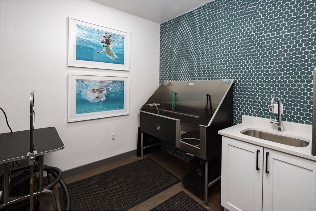 a small bathroom with a sink and a bath tub and a sink with a counter