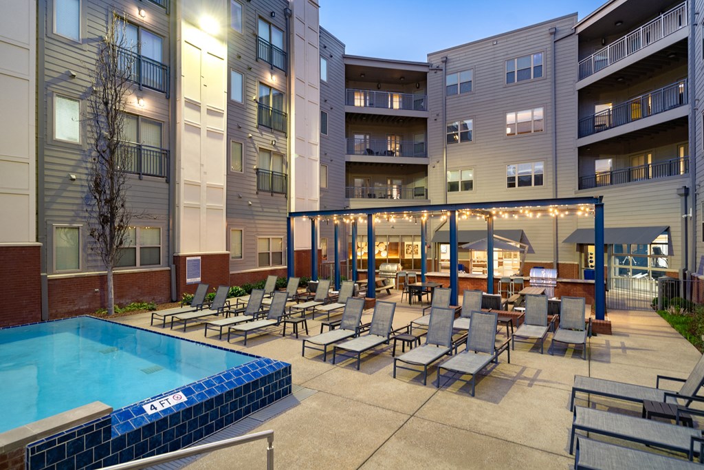 our apartments have a large pool and lounge area with chairs