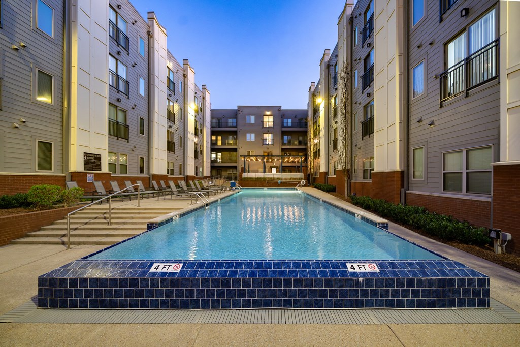 a swimming pool in the middle of an apartment building