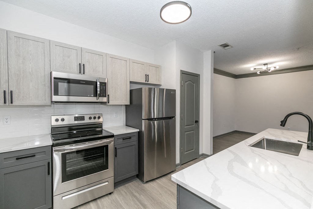 Renovated Kitchen new lighting and quartz countertops