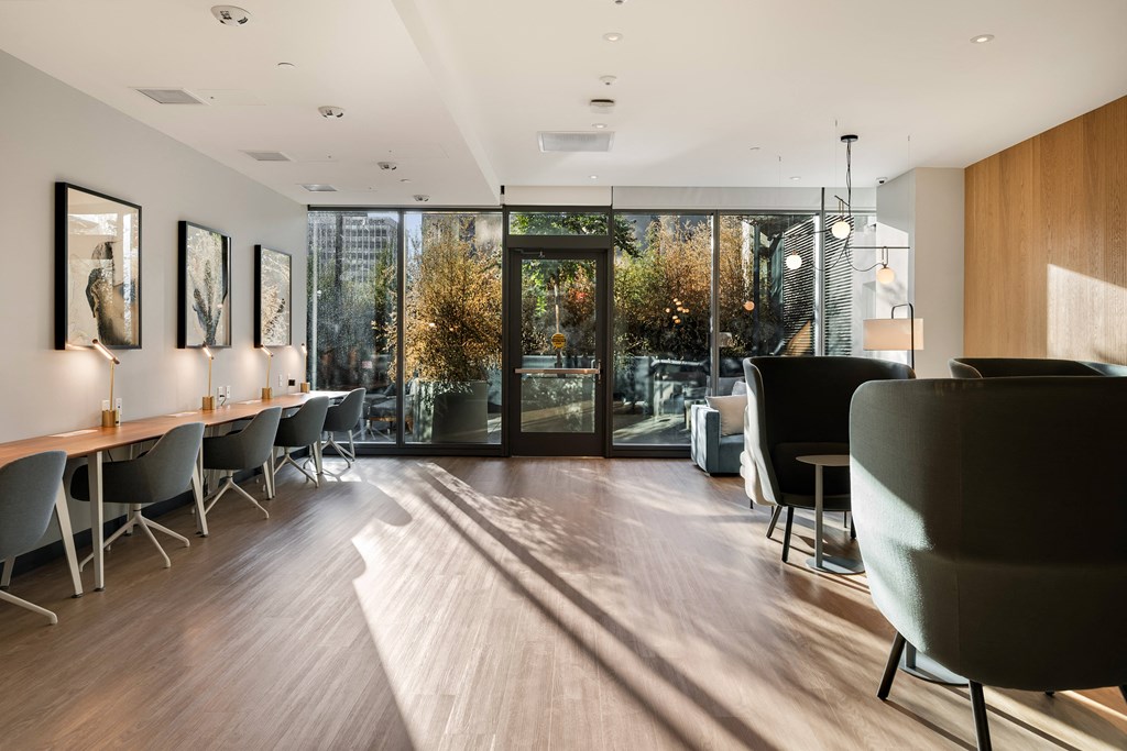 a large room with chairs and tables and sliding glass doors