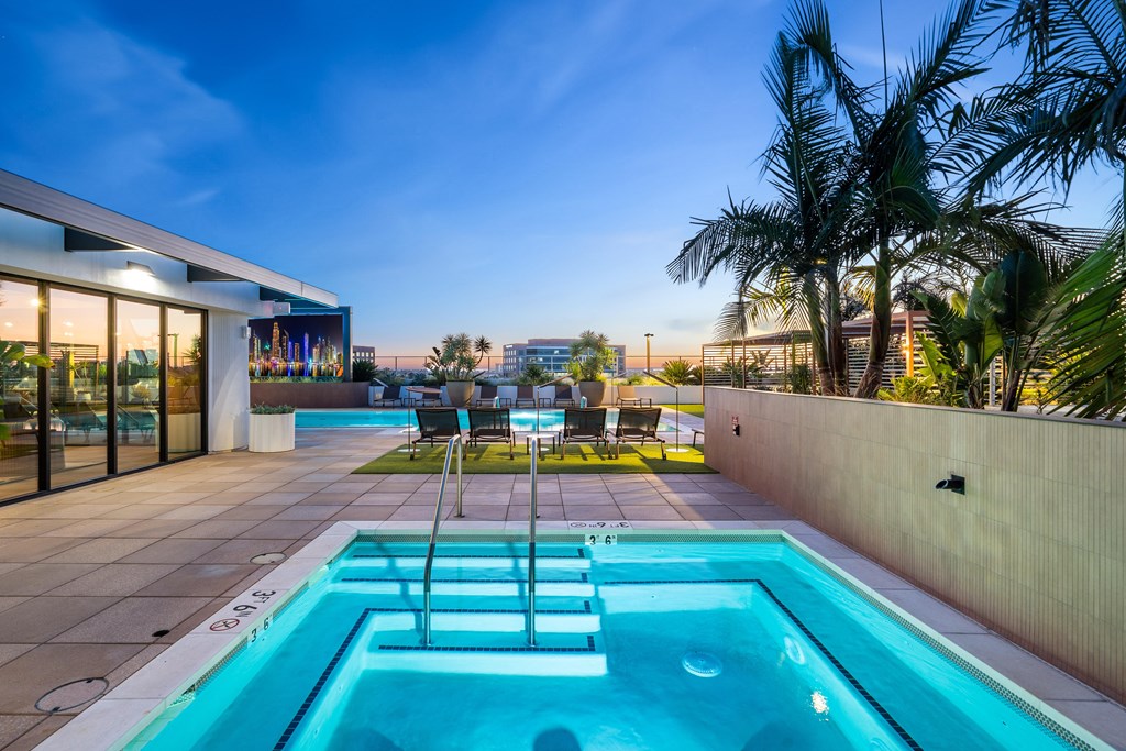 A modern house with a pool in the backyard.