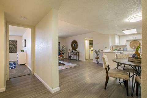 A well-lit, spacious living area with a dining table and chairs.