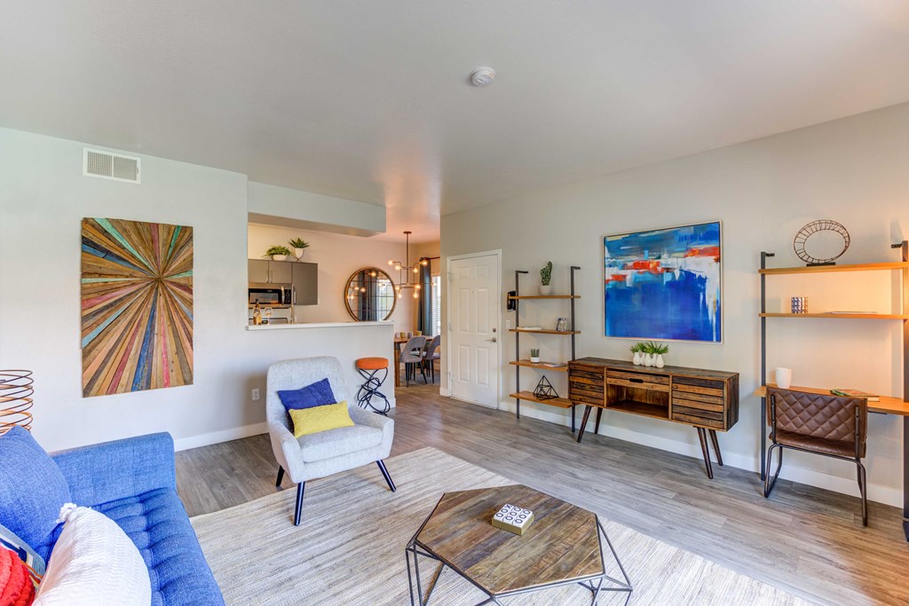 a living room with a blue couch and a coffee table