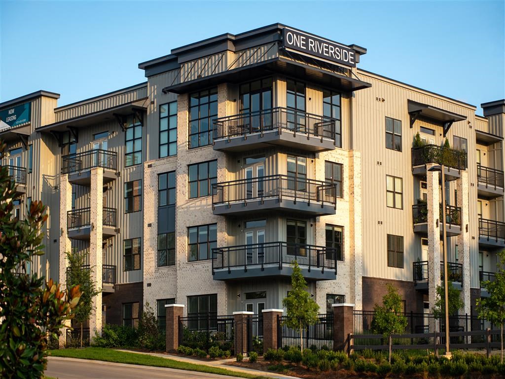 a rendering of a one bedroom apartment building with balconies