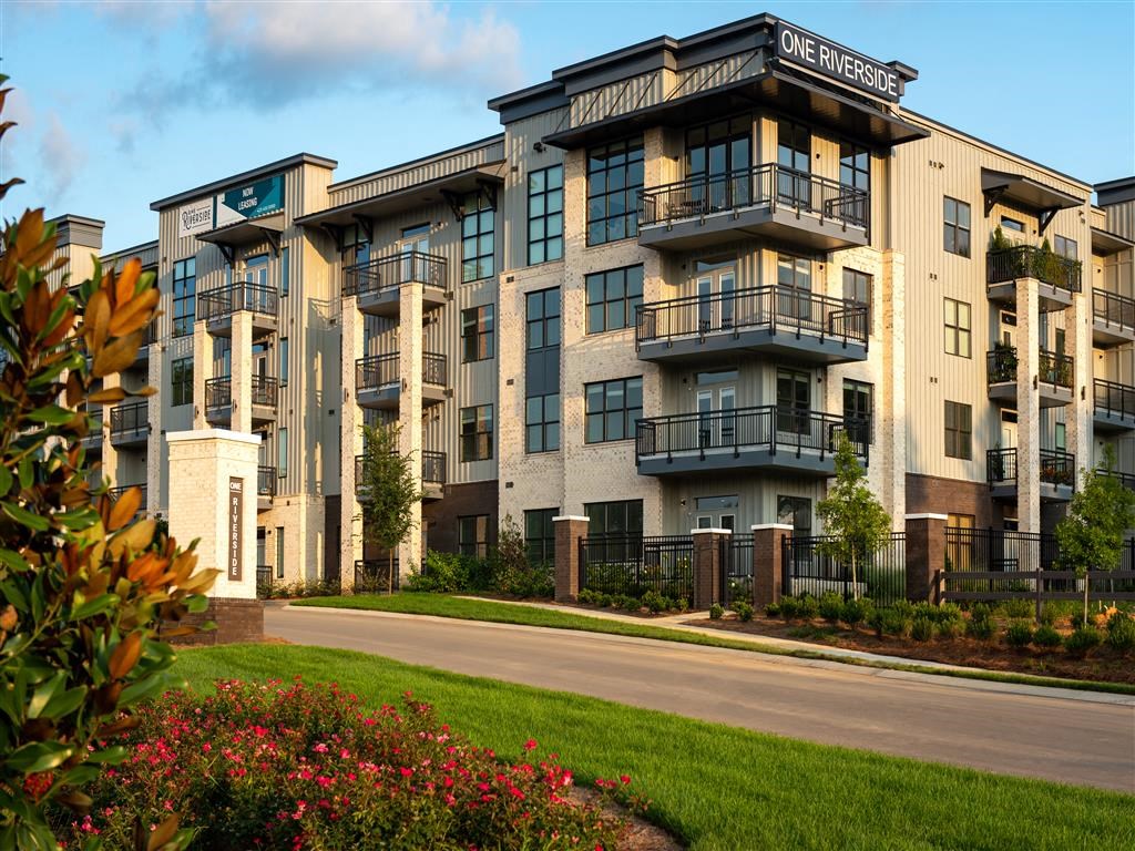 an apartment building on the side of a street