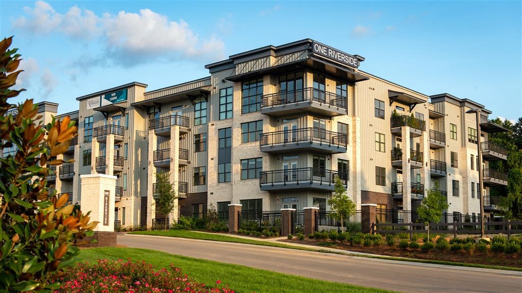 an apartment building on the side of a street