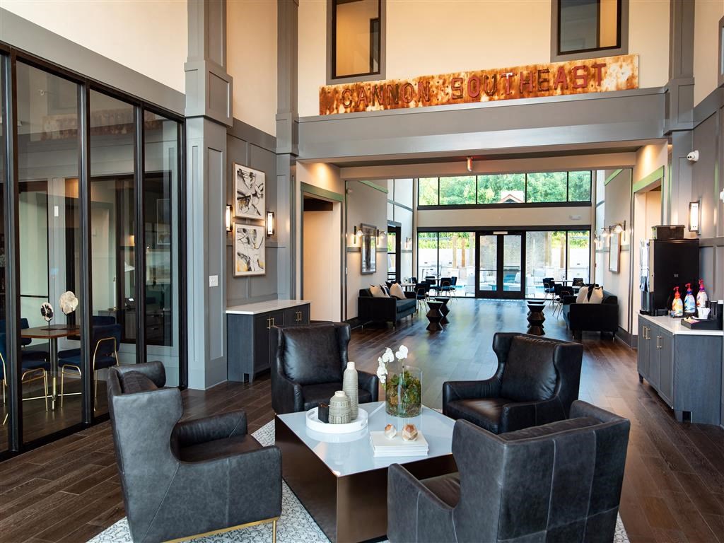 a large lobby with chairs and a table