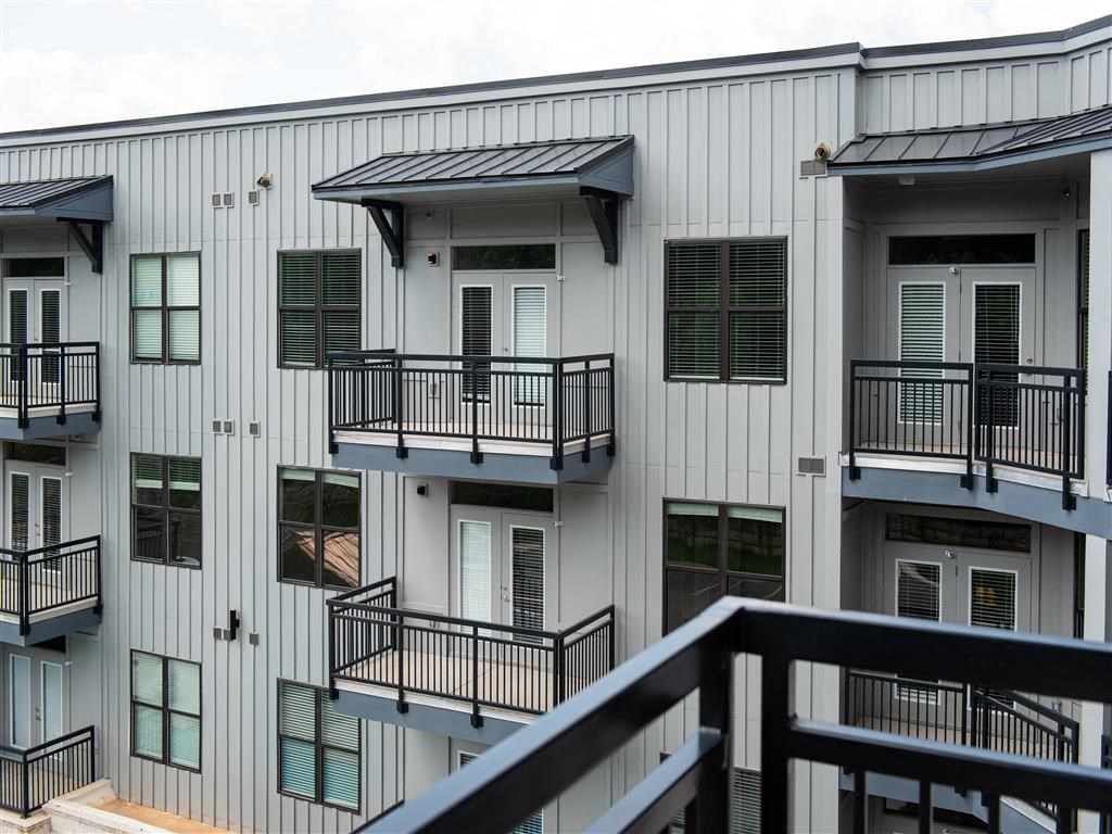 a balcony of a building with windows and balconies