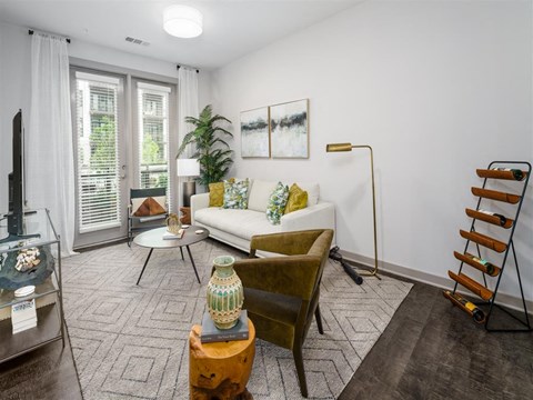a living room with a couch and a chair
