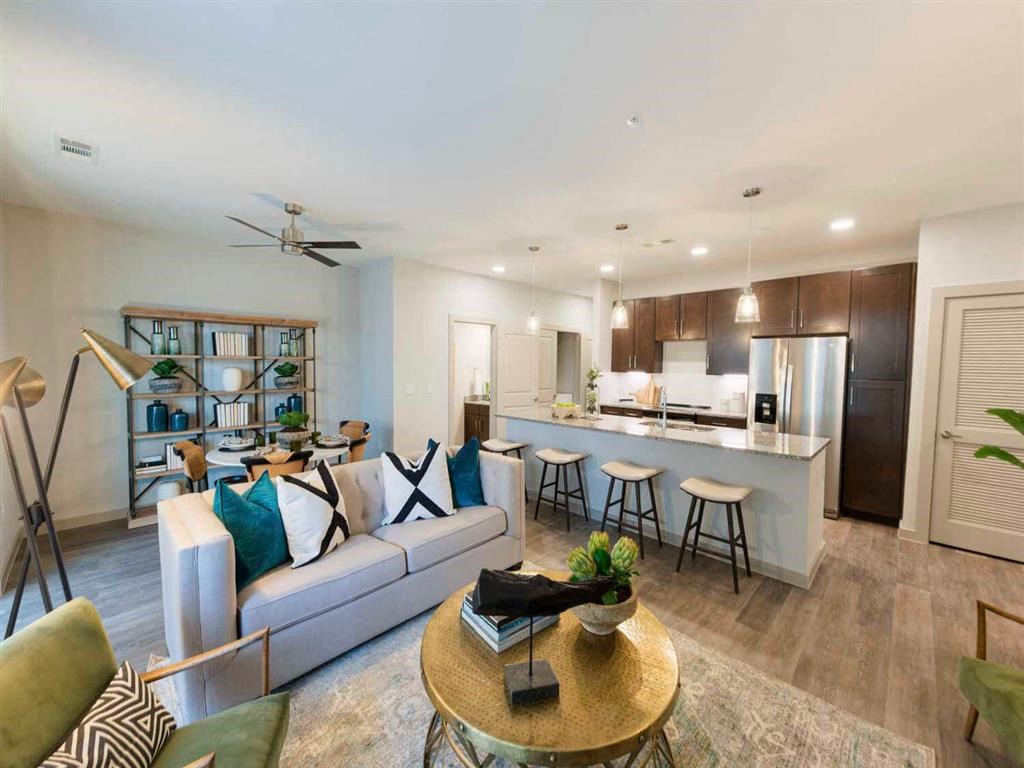 a view of a living room with a bar and a surfboard