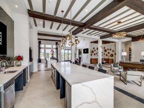 Kitchen with a large island at The Gregory Apartments, Porter, TX, 77365