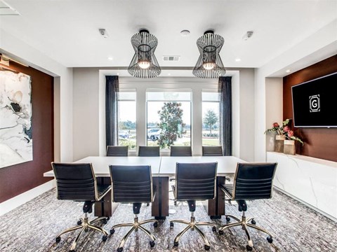 Conference room with a long table at The Gregory Apartments, Porter, 77365