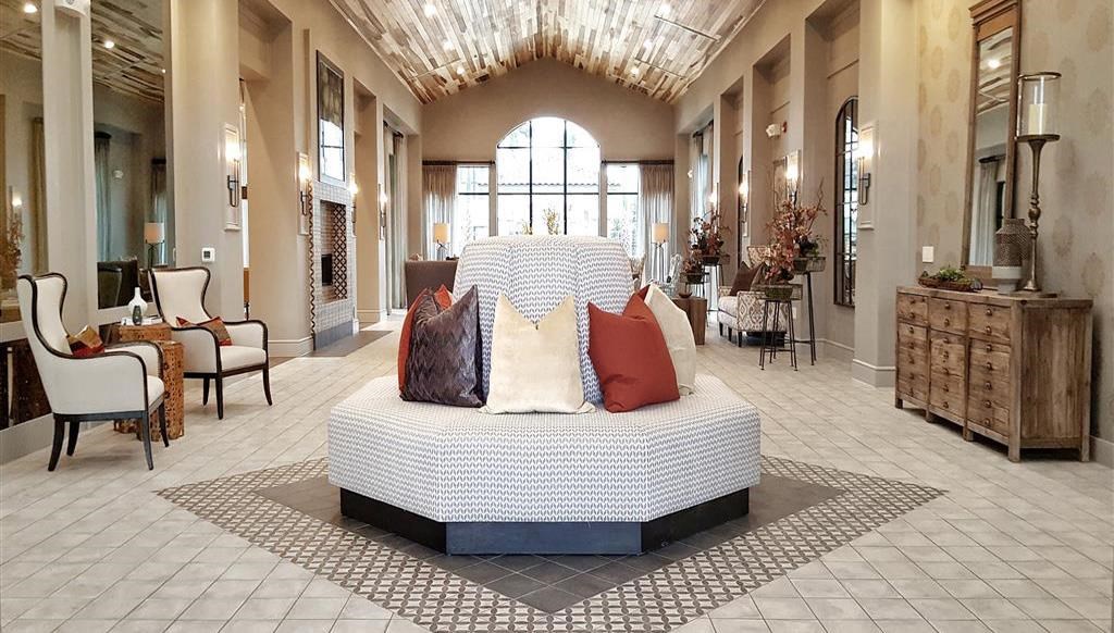 a large room with a bed in the middle of it