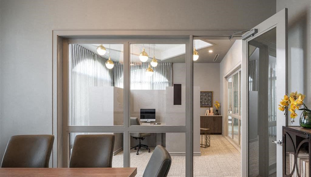 a conference room with a table and chairs