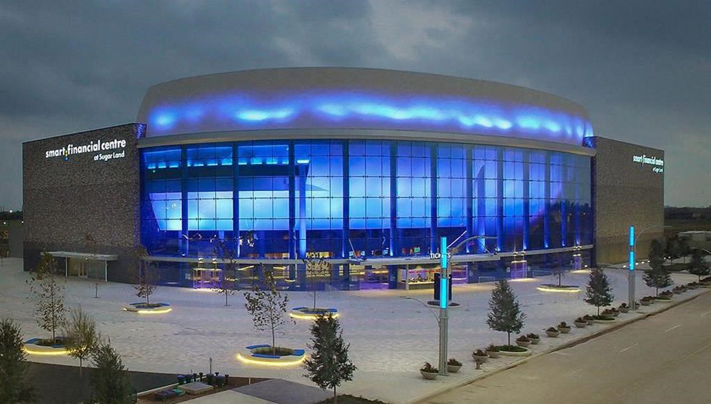 a large building with blue lights on it