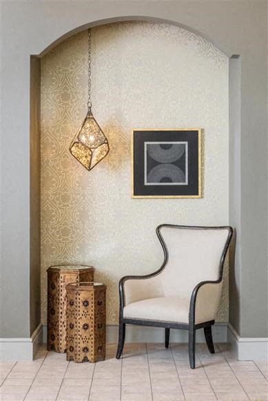 a chair and a lamp in a room