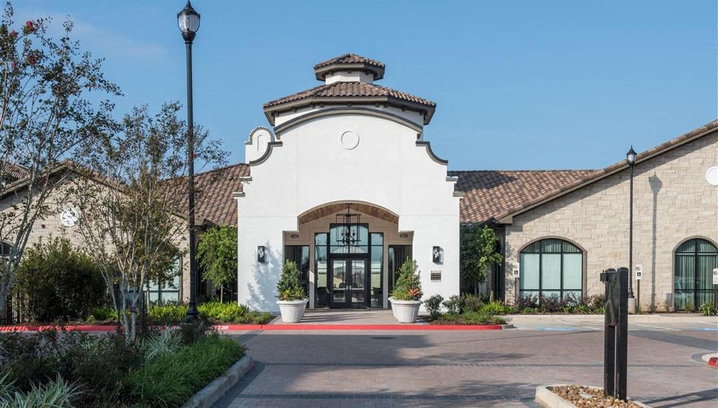 the facade of a building with a large glass door