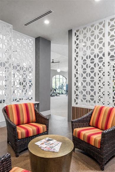 a living room with two chairs and a table