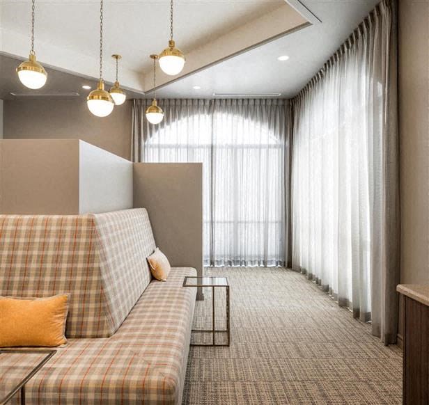 a living room with a couch and a window