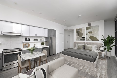 A modern kitchen with a dining table and chairs.