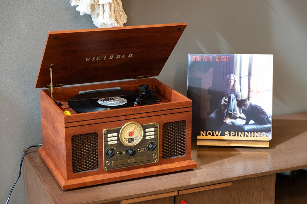 a record player and a book on a table