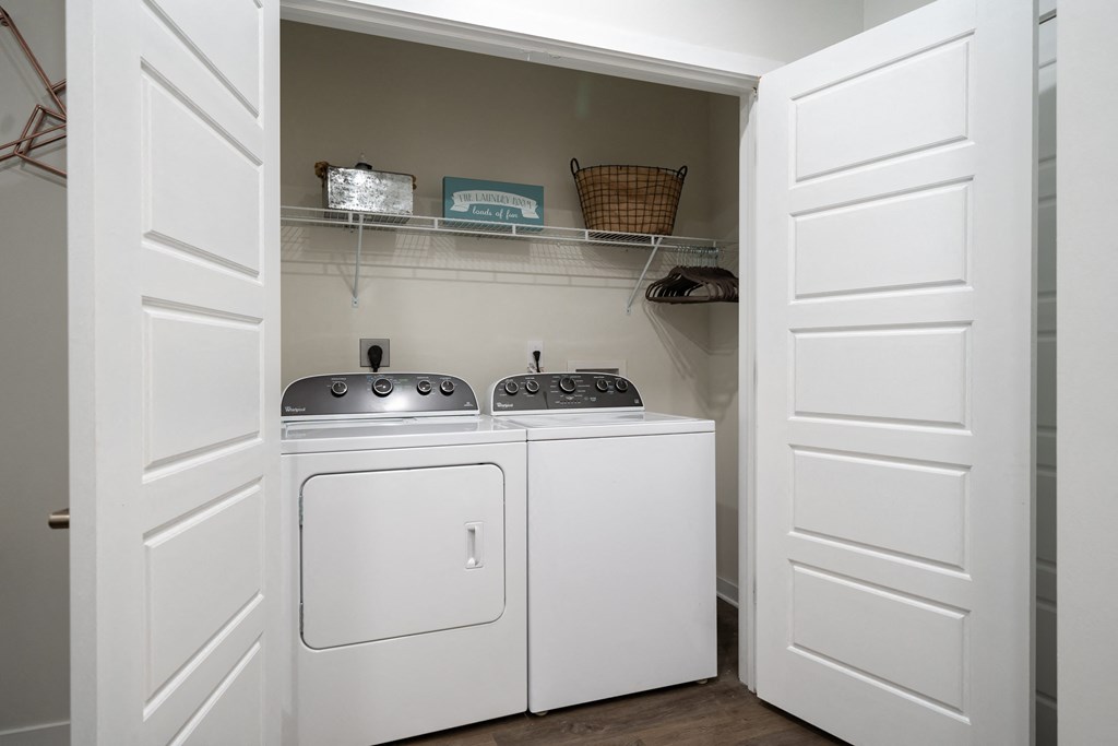 a small laundry room with a washer and dryer