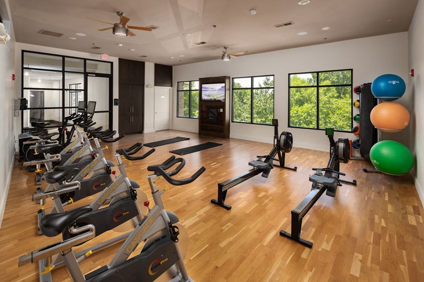 a room filled with lots of different types of exercise equipment