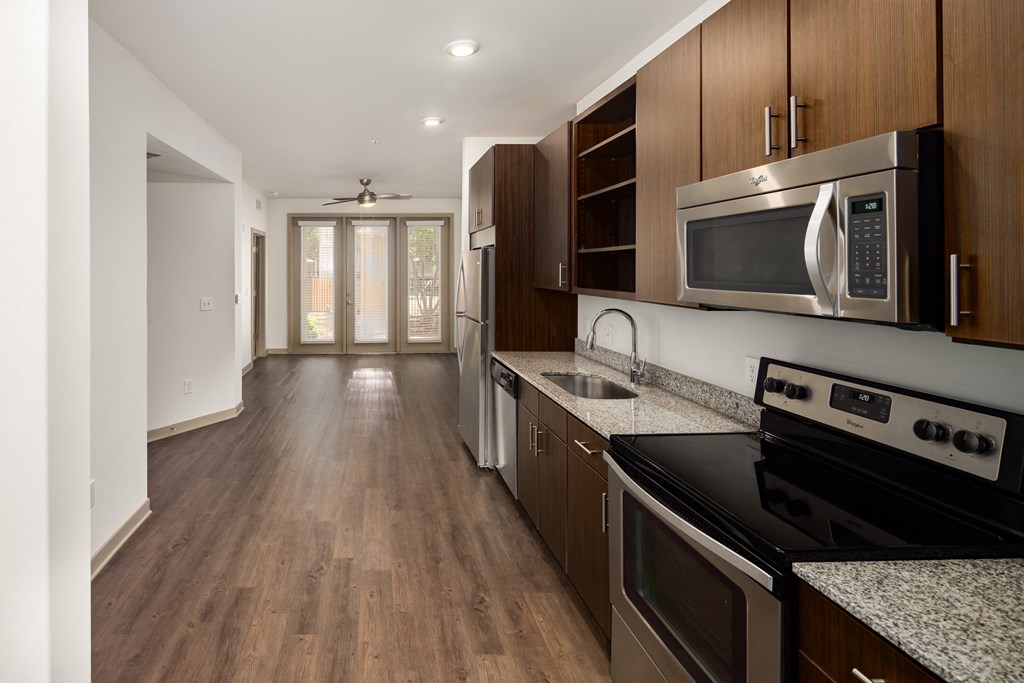 a kitchen and hallway in a 555 waverly unit