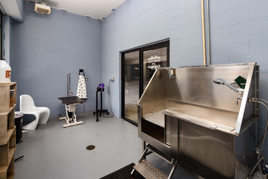 a large stainless steel machine in front of a glass door